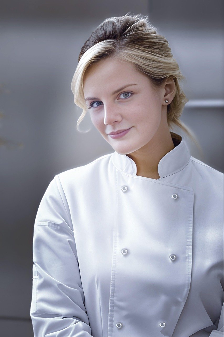 chef, female chef, cook, professional chef, culinary, kitchen, white uniform, gastronomy, cooking, food preparation, restaurant, hospitality, gourmet, young woman, confident woman, chef coat, modern kitchen, culinary art, elegant woman, food industry, chef portrait, kitchen staff, cuisine, culinary professional, food service